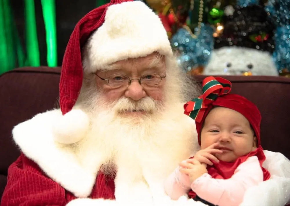 Santa with child at Christmas Spectacular